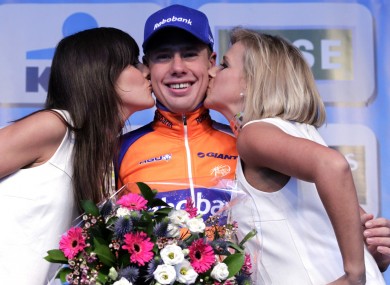 Netherlands cyclist Sebastian Langeveld is congratulated after winning the Belgian cycling classic 'Omloop Het Nieuwsblad'.