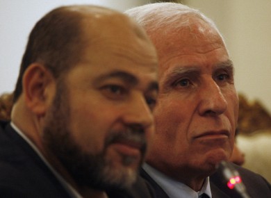 Chief Fatah negotiator in reconciliation talks Azzam al-Ahmed, right, and Hamas leader Moussa Abu Marzoug, left, look on during a news conference in Cairo, Egypt on Wednesday.