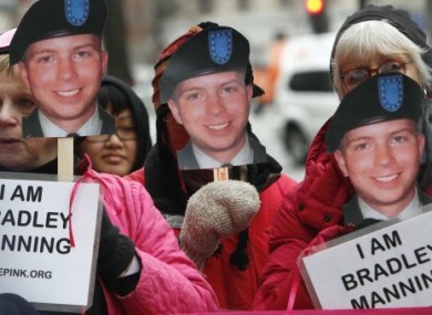 Bradley Manning supporters bearing placards during a demonstration outside the FBI headquarters in Washington DC in January 2011.