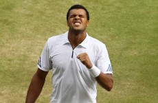Tsonga stuns Federer, as Djokovic topples Tomic in Wimbledon quarters