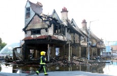 In photos: Fire crews work through the night as rioting spreads from London