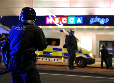 Riot police outside a bingo hall in Eltham, south London