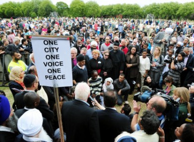 People holding a peace rally in Summerfield Park, Winson Green, Birmingham, yesterday.