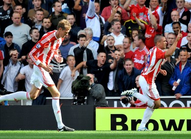 Jon Walters celebrates his penalty against Liverpool with Peter Crouch tailing