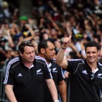 The injured Dan Carter (right) gives the crowd a thumbs up.