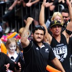 Scrum-half Piri Weepu leads the celebrations.