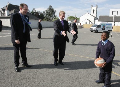 Mayor of Naas Darren Scully pictured with Fine Gael Leader Enda Kenny TD with school children in Kill National School in Kill County Kildare, on day two of the General Election 07.