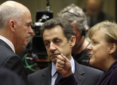 Papandreou with Sarkozy and Merkel in Brussels earlier this year