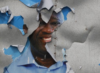A defaced Laurent Gbagbo election poster in Abidjan.