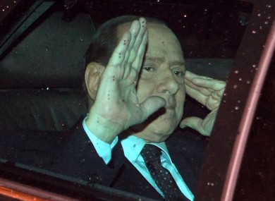 Berlusoni waves to journalists as he leaves the Quirinale, Presidential palace, after meeting with Italian President Giorgio Napolitano last night