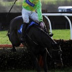 Colm McCormack on Patavium is covered in mud during the Wensley Amateur Riders Hurdle at Catterick Racecourse on Tuesday. 