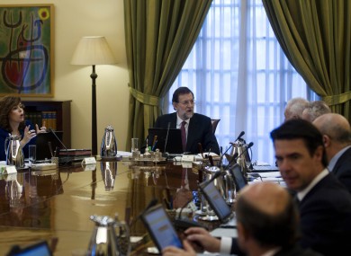Spain's new Prime Minister Mariano Rajoy, centre, heads the new government's first cabinet meeting at the Moncloa Palace in Madrid, last Friday