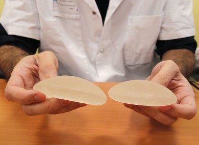A plastic surgeon hold silicone gel breast implants made by French company PIP, which may be unsafe.