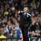 Manchester City manager Roberto Mancini throws the ball back onto the pitch during his side's 1-0 defeat to Liverpool at Eastlands on Wednesday night. 