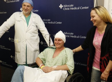 Neurosurgeon Leslie Schaffer, left, smiles with his patient Dante Autullo, and Dante's fiance, Gail Glaenzer during a news conference at Advocate Christ Medical Center in Illinois yesterday