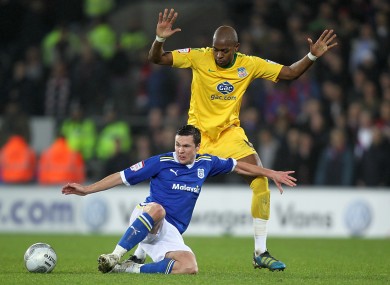 Cardiff City's Don Cowie and Crystal Palace's Anthony Gardner battle for the ball.