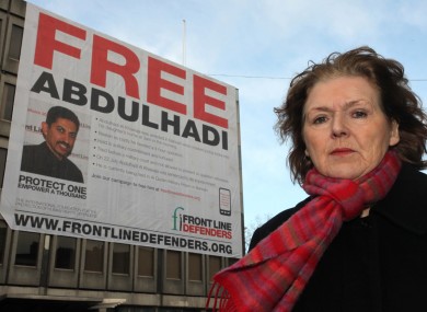 Mary Lawlor of Frontline Defenders in front of the banner bearing Abdulhadi's image on Earlsfort Terrace/St Stephen's Green