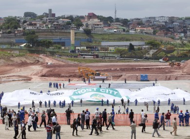 A sign is displayed at the site where Corinthians' new stadium is being built, after the FIFA confirmed the city of Sao Paulo as the host of the opening ceremony for the 2014 World Cup.