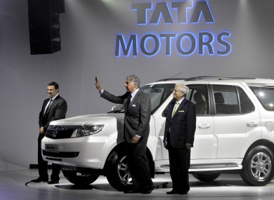Tata Sons deputy chairman Cyrus Mistry (left), chairman Ratan Tata (centre) and Tata Motors vice-chairman Ravi Kant pose during a press preview at the India Auto Expo in New Delhi.