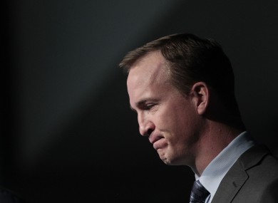 Peyton Manning collects his thoughts as he speaks during a news conference in Indianapolis