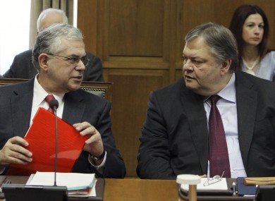 Greek PM Lucas Papademos and Finance Minister Evangelos Venizelos at cabinet meeting in Athens today.