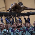 Members of the Spanish Legion, an elite unit of the Spanish Army, hold up the El Cristo de la Buena Muerte, or Christ of the Good Death, during a ceremony ahead of the procession in Malaga, Southern Spain (AP Photo/Emilio Morenatti)