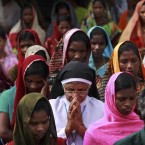 Indian tribal Catholics kneel as they pray at Jesus Hill during Good Friday at Dantilingi in the eastern Indian state of Orissa (AP Photo/Biswaranjan Rout)