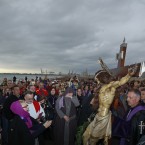 Worshippers surround the icon of the Santisimo Cristo del Salvador brotherhood during a Holy Week procession in Valencia, Spain. (AP Photo/Alberto Saiz)