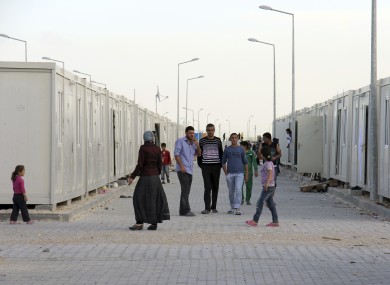 Syrian refugees at a camp across the Turkish border, where thousands have fled