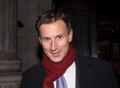 British Culture Secretary Jeremy Hunt leaves his office in London yesterday as the pressure mounted.