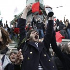 Supporters of President-elect Francois Hollande react after the results of the French Presidential elections at Bastille square in Paris, France, Sunday, May 6, 2012. (AP Photo/Laurent Cipriani)