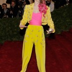 Coco Rocha arrives in a Elizabeth Taylor jumpsuit, complete with red wine stains that she didn't want to get dry-cleaned off after buying the ensemble at an auction. 

Image: AP Photo/Charles Sykes