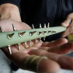 Sophomore student Wang Qi shows his homemade hand massager at dormitory at Chongqing Normal University on May 7, 2012 in Chongqing, China. When he was a child, Wang started to practice Qigong following Kung Fu Movies. (Photo by ChinaFotoPress)
