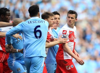 Tempers flare after Queens Park Rangers' Joey Barton clashes with Manchester City's Sergio Aguero.