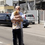 Mr Borghi, who lost his son in the building, embraces his wife in front of the destroyed BBG industrial mouldings in Mirandola, northern Italy, today. A magnitude 5.8 earthquake struck northern Italy, killing at least 10 people as factories, warehouses and a church collapsed in the same region still struggling to recover from another deadly tremor nine days ago. (AP Photo/Luca Bruno)