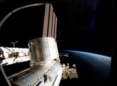 Part of the ISS and Earth photographed from the spacecraft.