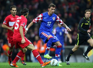 Wolfsburg's Mario Mandzukic scored three goals in qualifying.