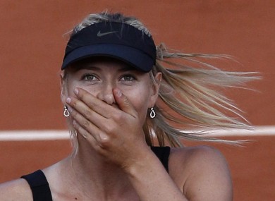 Maria Sharapova reacts as she defeats Petra Kvitova.
