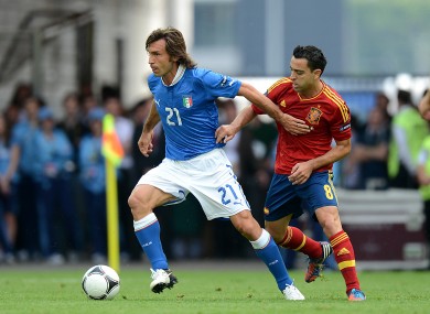 Andrea Pirlo and Spain's Xavi.