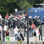 Police bring a water cannon as fan clashes prior to the Euro 2012 soccer championship Group A match between Poland and Russia in Warsaw, Poland, Tuesday, June 12, 2012. Russian soccer fans clashed with police and Poland supporters in separate incidents in Warsaw on Tuesday, just hours before the two teams were to meet in an emotionally charged European Championship match. Several people were injured. (AP Photo/Alik Keplicz)