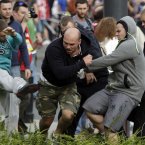 Fans clash prior to the Euro 2012 soccer championship Group A match between Poland and Russia in Warsaw, Poland, Tuesday, June 12, 2012. (AP Photo/Gero Breloer)