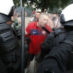 A Polish soccer fan argues with police prior to the Euro 2012 group A soccer match between Poland and Russia in Warsaw, Poland , Tuesday, June 12, 2012. (AP Photo/Czarek Sokolowski)