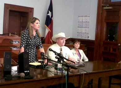 From left: DA Heather McMinn speaks at a news conference with Sheriff Micah Harmon and the attorney for the father.