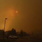 Smoke and flames from the Waldo Canyon fire turn the sky above west Colorado Springs orange. (AP Photo/Bryan Oller/PA)