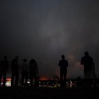 The fire made a massive run late in the day leaving a trail of destruction in its path. (AP Photo/Bryan Oller/PA)
