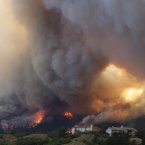 Fire from the Waldo Canyon wildfire burns as it moved towards homes in Colorado Springs yesterday. (AP Photo/Gaylon Wampler/PA)