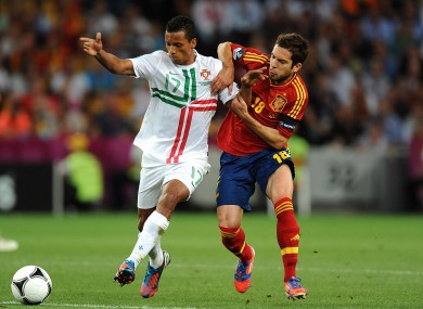 Spain's Ramos Jordi Alba (right) and Portugal's Luis Nani battle for the ball last night.