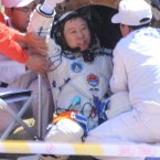 Liu Wang comes out of the re-entry capsule (Photo by tonglaga/Chinafotopress)