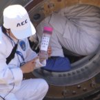 Chinese engineers work on the re-entry capsule of the Shenzhou-9 spacecraft (Photo by tonglaga/Chinafotopress)