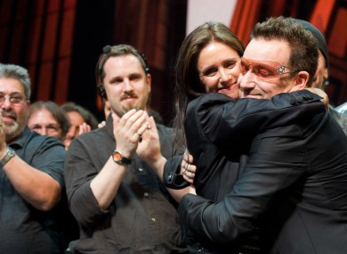 Julie Taymor and Bono appear onstage at the curtain call for the opening night performance of the Broadway musical